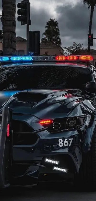 Sleek police car with flashing lights on a city street at night.