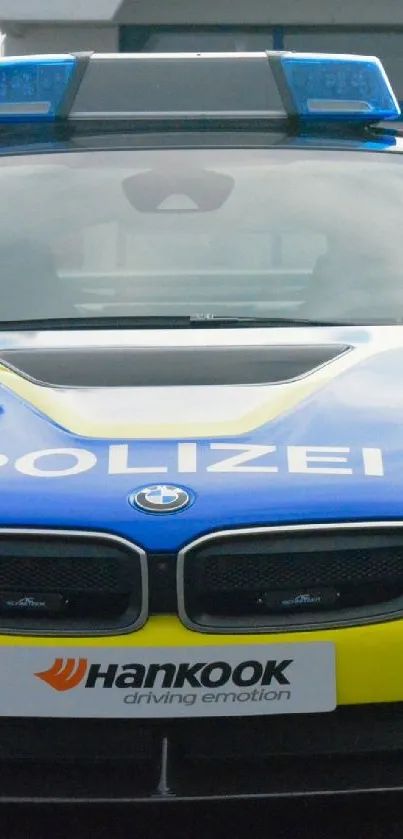 Sleek blue and yellow BMW police car.