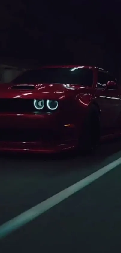 Red car speeding through a dimly lit tunnel, creating a dynamic and sleek look.