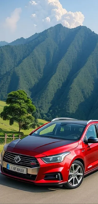 Red car drives along a scenic green mountain road.