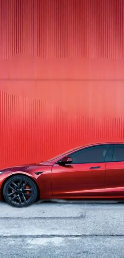 Sleek red car in urban setting, vibrant wallpaper.