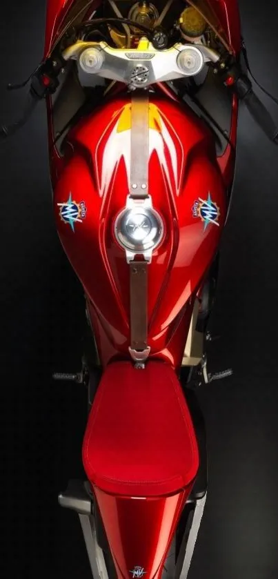 Top-down view of a sleek, red motorcycle with elegant design details.