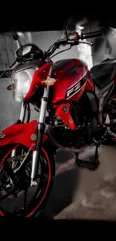 Sleek red motorcycle with a modern design on a dark background.