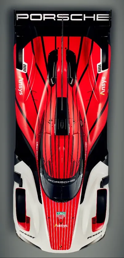 Top view of sleek, red sports car wallpaper for mobile.