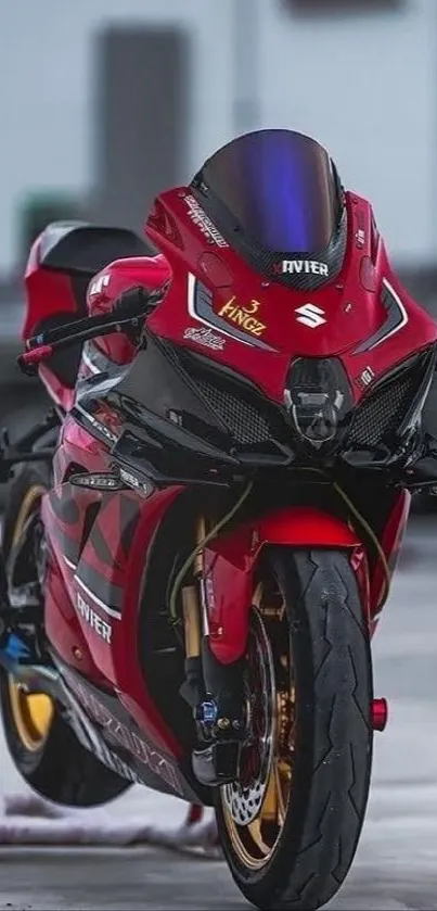 Dynamic red sports bike stands on a road, showcasing sleek and powerful design.
