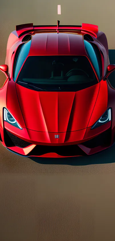 Top-down view of a sleek red sports car on a road.