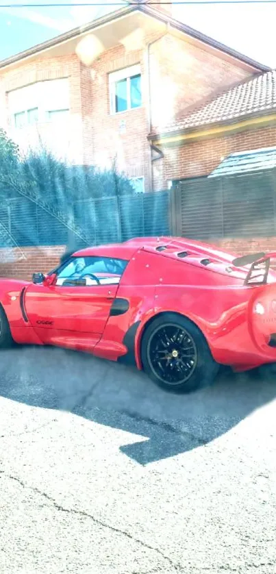 A sleek red sports car parked on a sunny urban street.