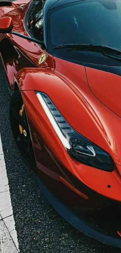 Sleek red sports car on a city street, perfect for mobile wallpaper.