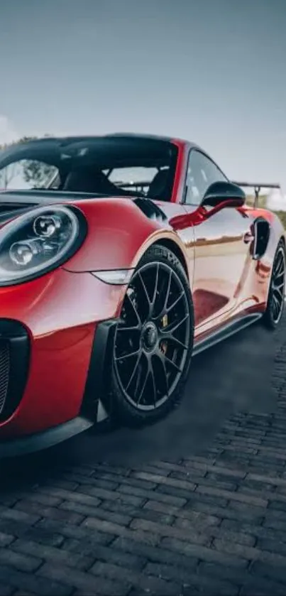 Vibrant red sports car on open road.