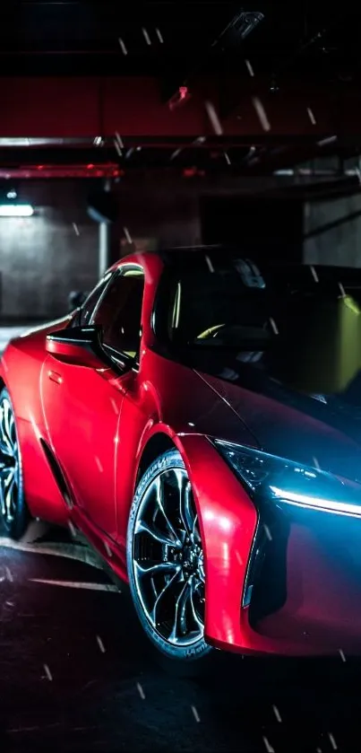 Sleek red sports car in a dimly-lit garage.