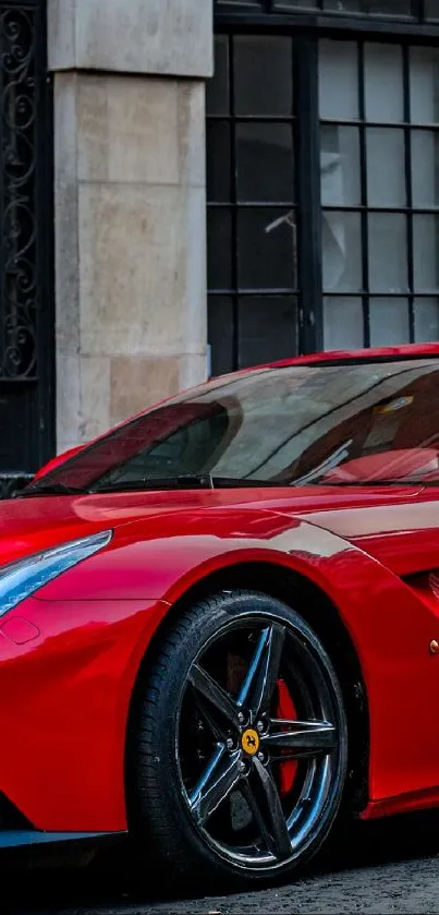 Red sports car parked on urban street.