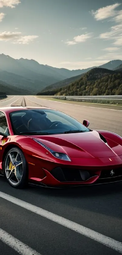 Red sports car driving on mountain road with scenic view.