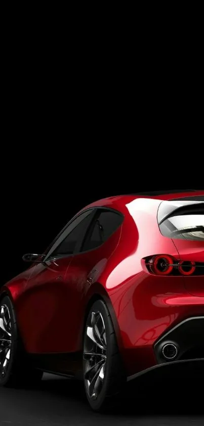 Red sports car with a sleek design on a dark background wallpaper.