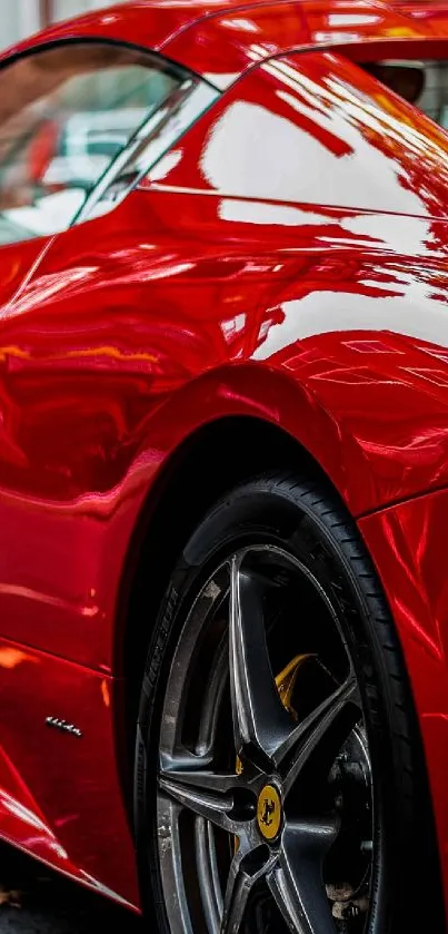 Elegant red sports car with a glossy finish parked by the roadside.