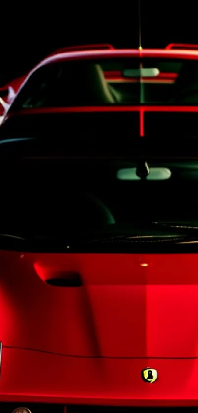 Red sports car with sleek design and black background.