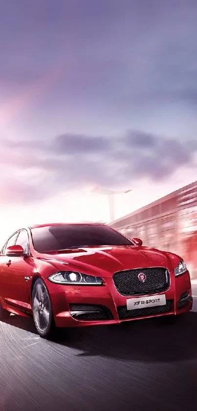 Sleek red sports car speeding on a highway.