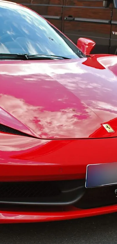 Sleek red sports car as mobile wallpaper.