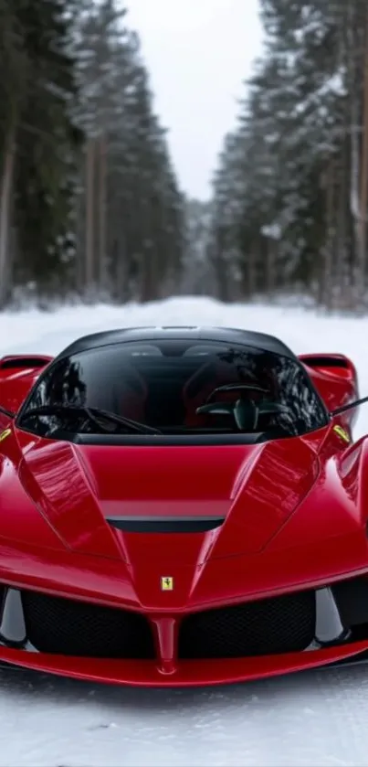 Sleek red sports car in a winter forest setting.