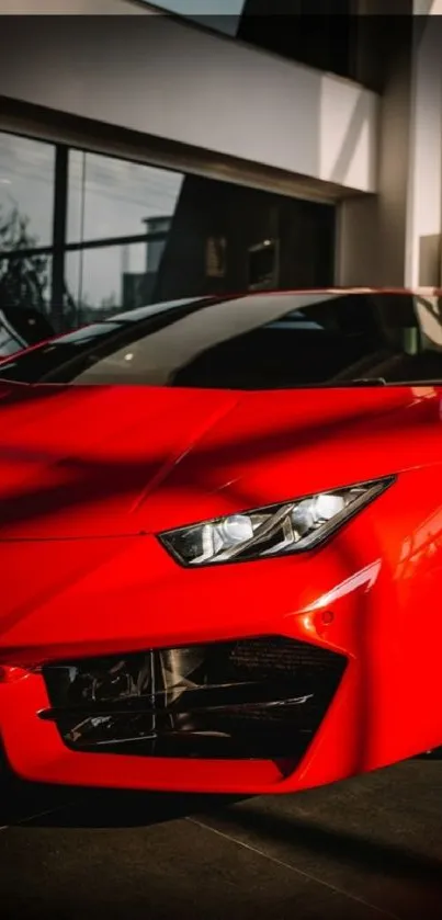 Dynamic red sports car in a showroom setting.