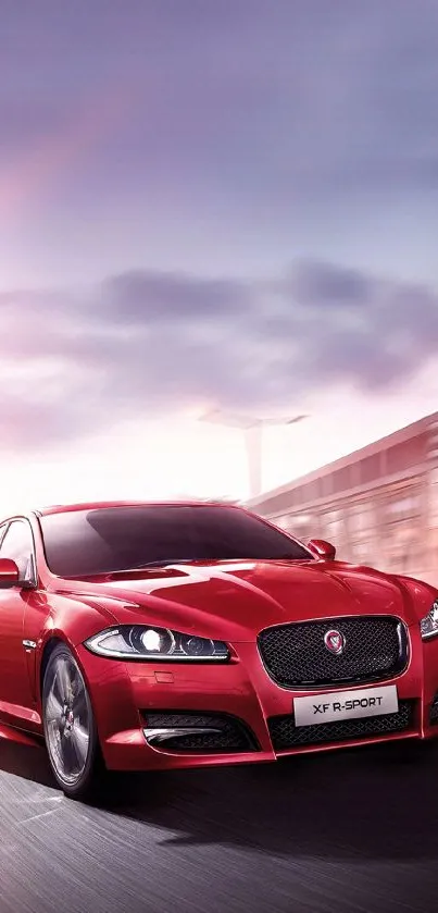 Sleek red sports car driving on road.