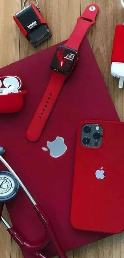 Red tech gadgets elegantly arranged on a wooden background.