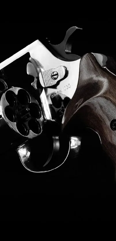 Polished revolver against a dark background, perfect for mobile wallpaper.