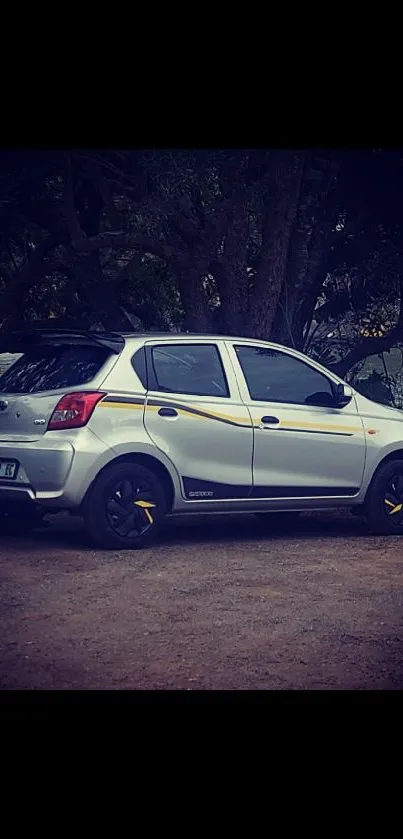 Sleek silver hatchback parked in natural setting.