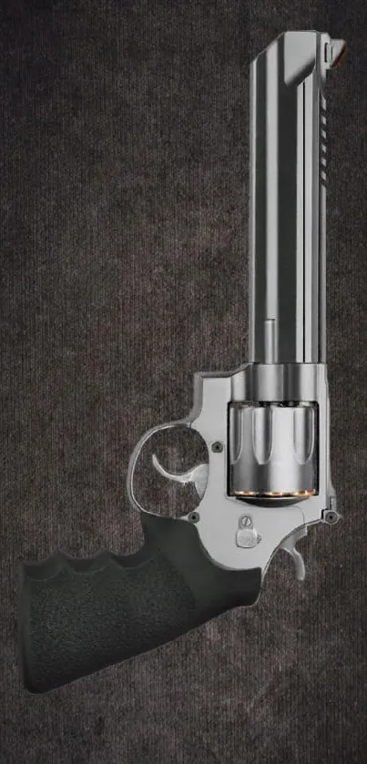 Silver revolver against dark textured background wallpaper.