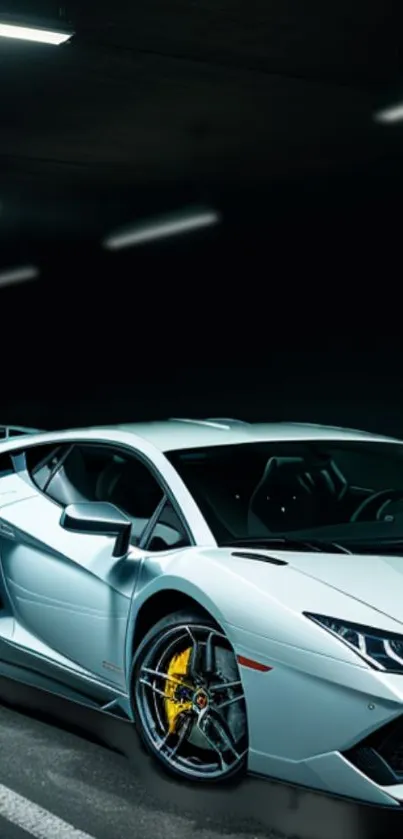 Sleek silver sports car in a modern garage setting.