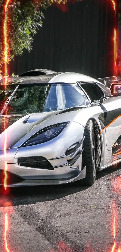Sleek silver sports car parked by the roadside.