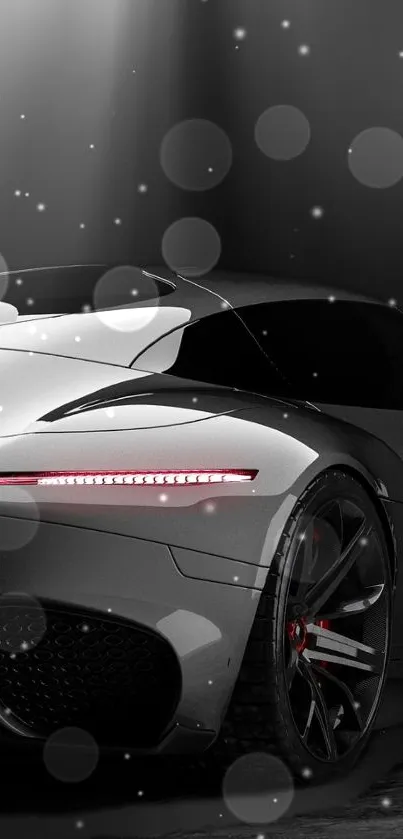 Sleek silver sports car under spotlight in a modern wallpaper.