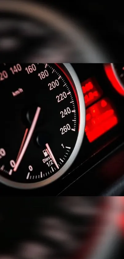 Close-up of sleek car speedometer with red accents.