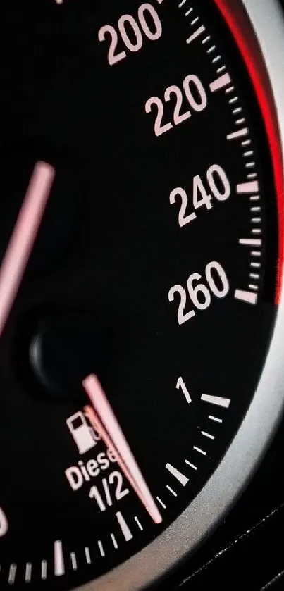 Sleek speedometer with red accents for car enthusiasts.