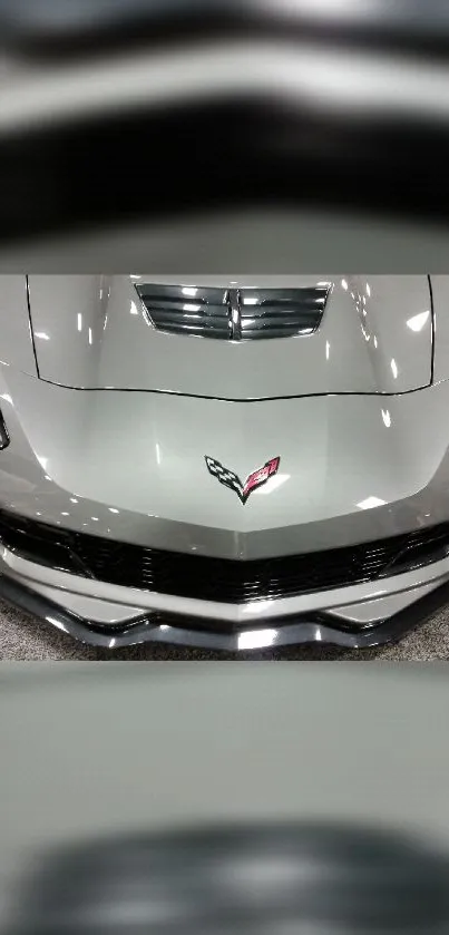 Front view of a sleek silver sports car, showcasing luxury and modern design.