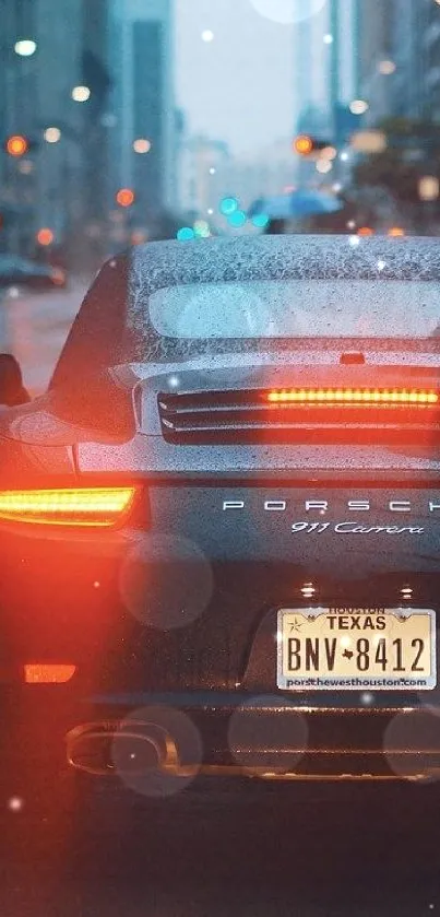 Sleek sports car navigating a rainy urban street at night.