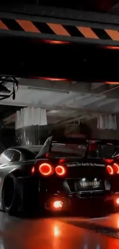 Sleek sports car with glowing tail lights in a dimly lit garage.