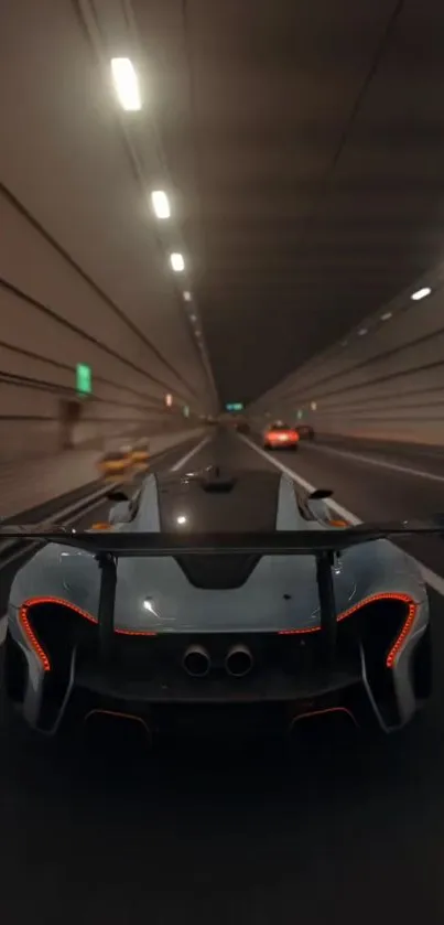 Sleek sports car driving in a dimly lit tunnel.