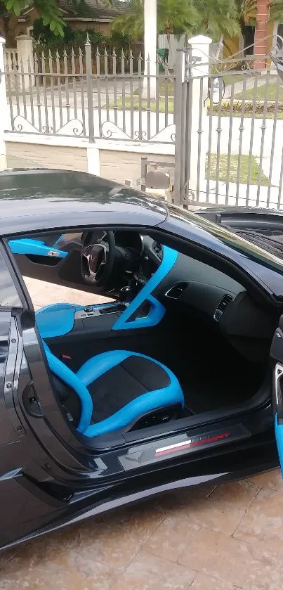 Black sports car with blue interior details.