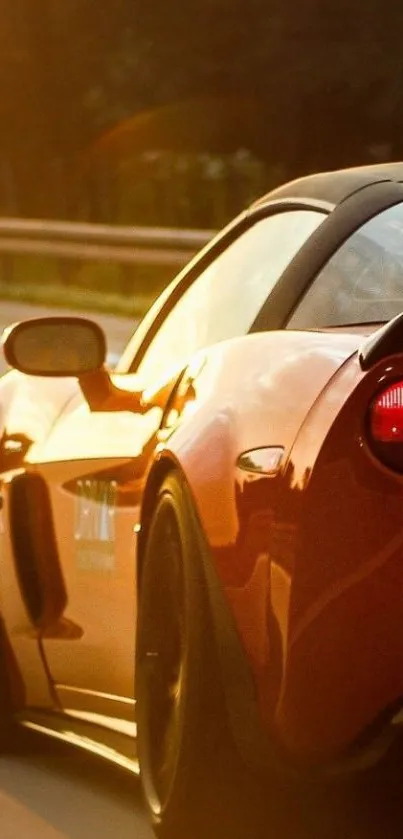 Sleek sports car driving on a sunny highway.