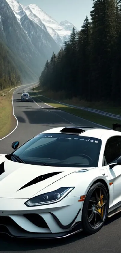 Sleek sports car driving scenic mountain road under blue skies.