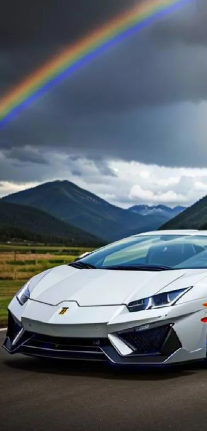 Sleek sports car under a vibrant rainbow with mountain backdrop.