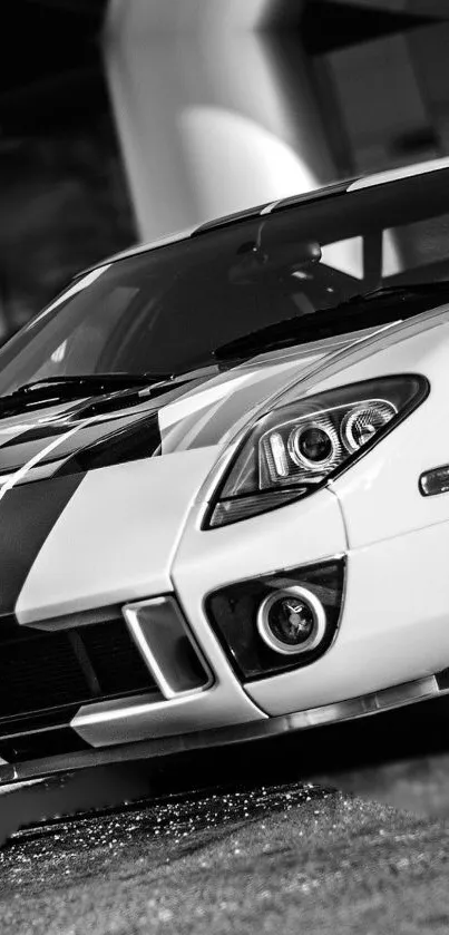 Black and white sports car with sleek design and stripes.