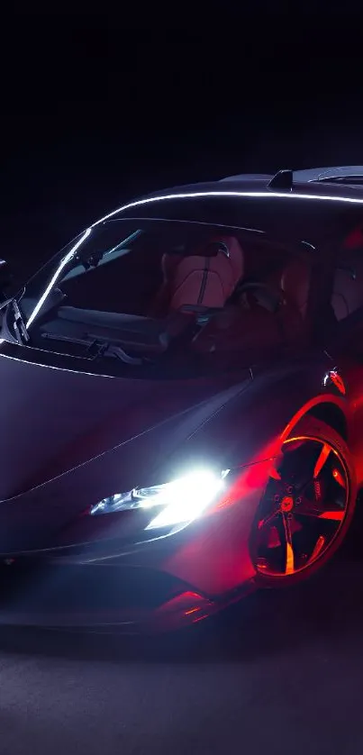 Sleek sports car with red lighting against black background.