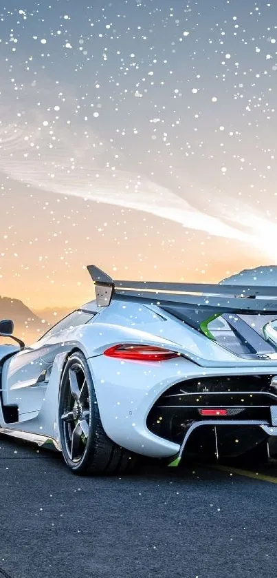 Sleek sports car on a mountain road with a blue sky backdrop.