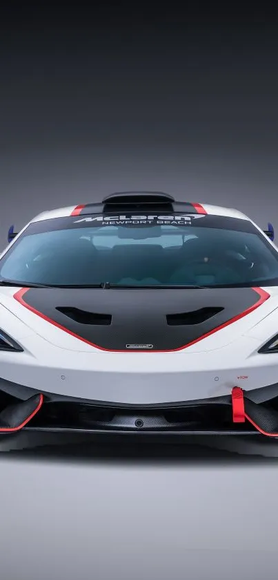 Front view of a sleek, white sports car with black and red accents.