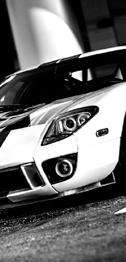 Black and white sports car parked in a sleek, modern environment.