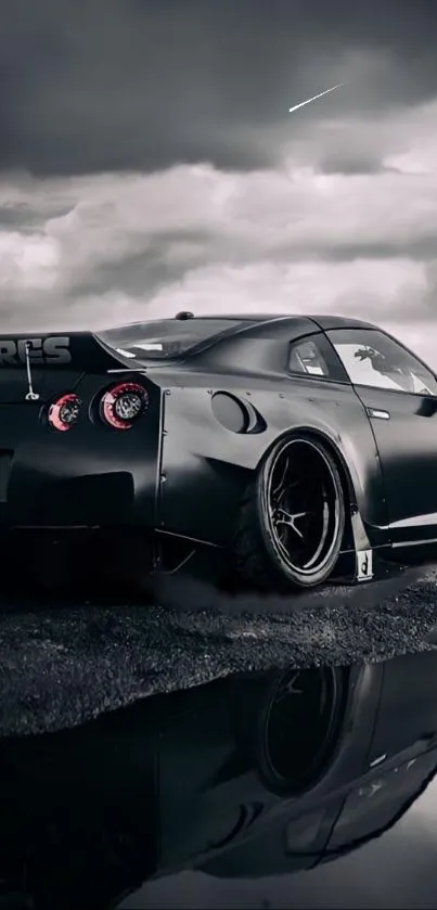 Black sports car on reflective road under cloudy sky.