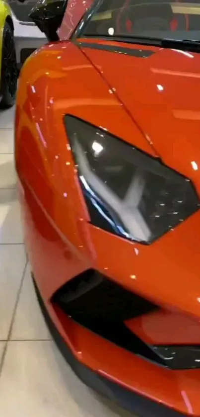 Sleek red sports car in dealership.