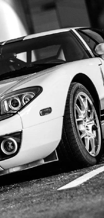 Sleek black and white sports car parked outdoors.