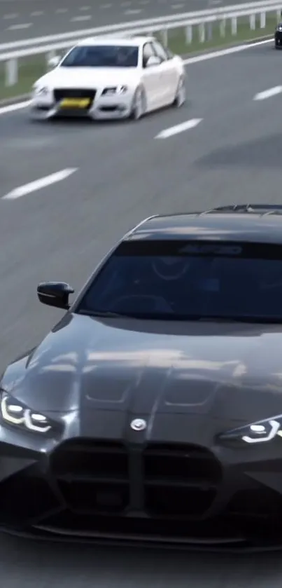 Sleek dark gray sports car in motion on a busy highway.